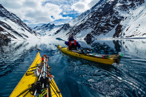 Open image in slideshow, Josh Daiek using Kayaks to access skiing on Laguna de Incas in Portillo, Chile

