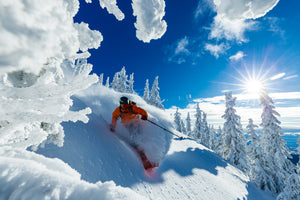 Open image in slideshow, Kyle Taylor skiing at Whitefish Mountain Resort
